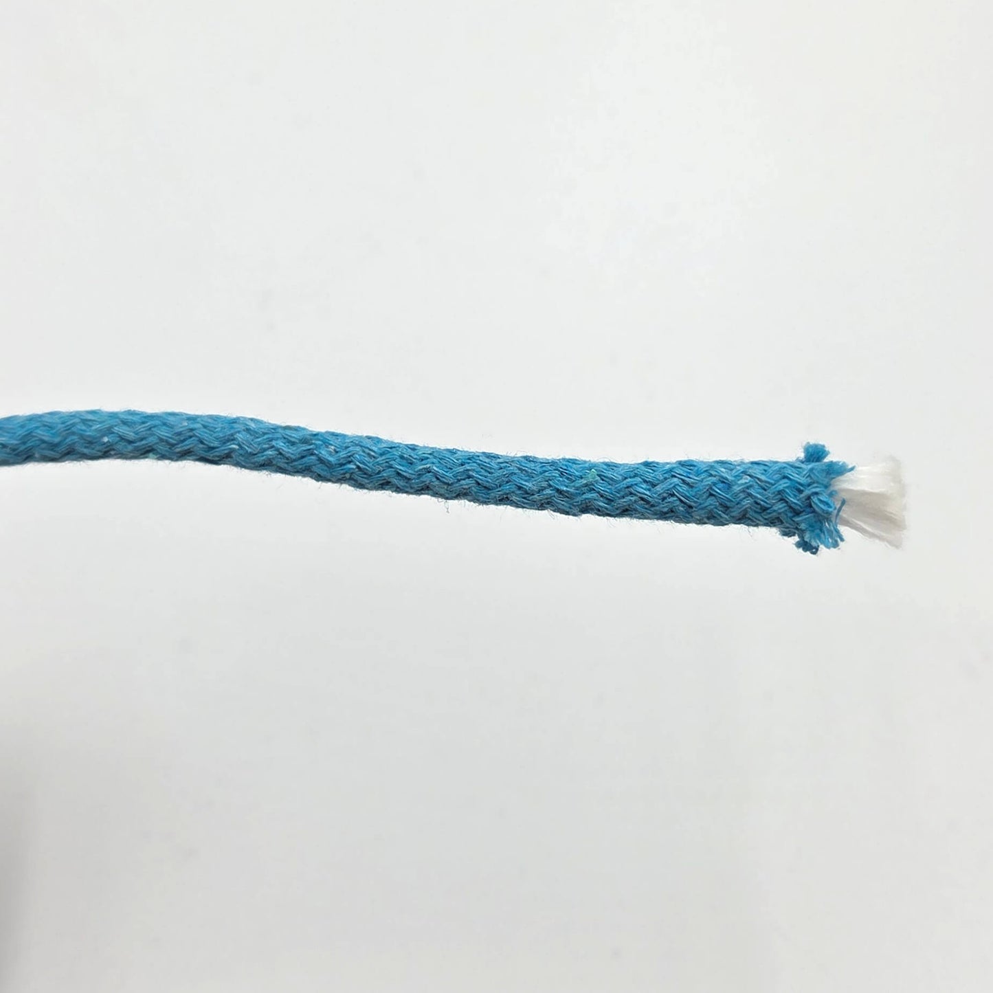 A close-up of a braided blue rope with a frayed white end, shown against a plain white background.