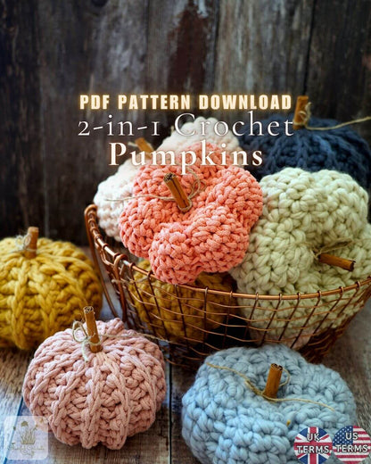 A promotional image for a PDF crochet pumpkin pattern, showing several crocheted pumpkins in pastel and autumn colors arranged in and around a wire basket against a rustic wooden background. Text reads 'PDF PATTERN DOWNLOAD 2-in-1 Crochet Pumpkins'.