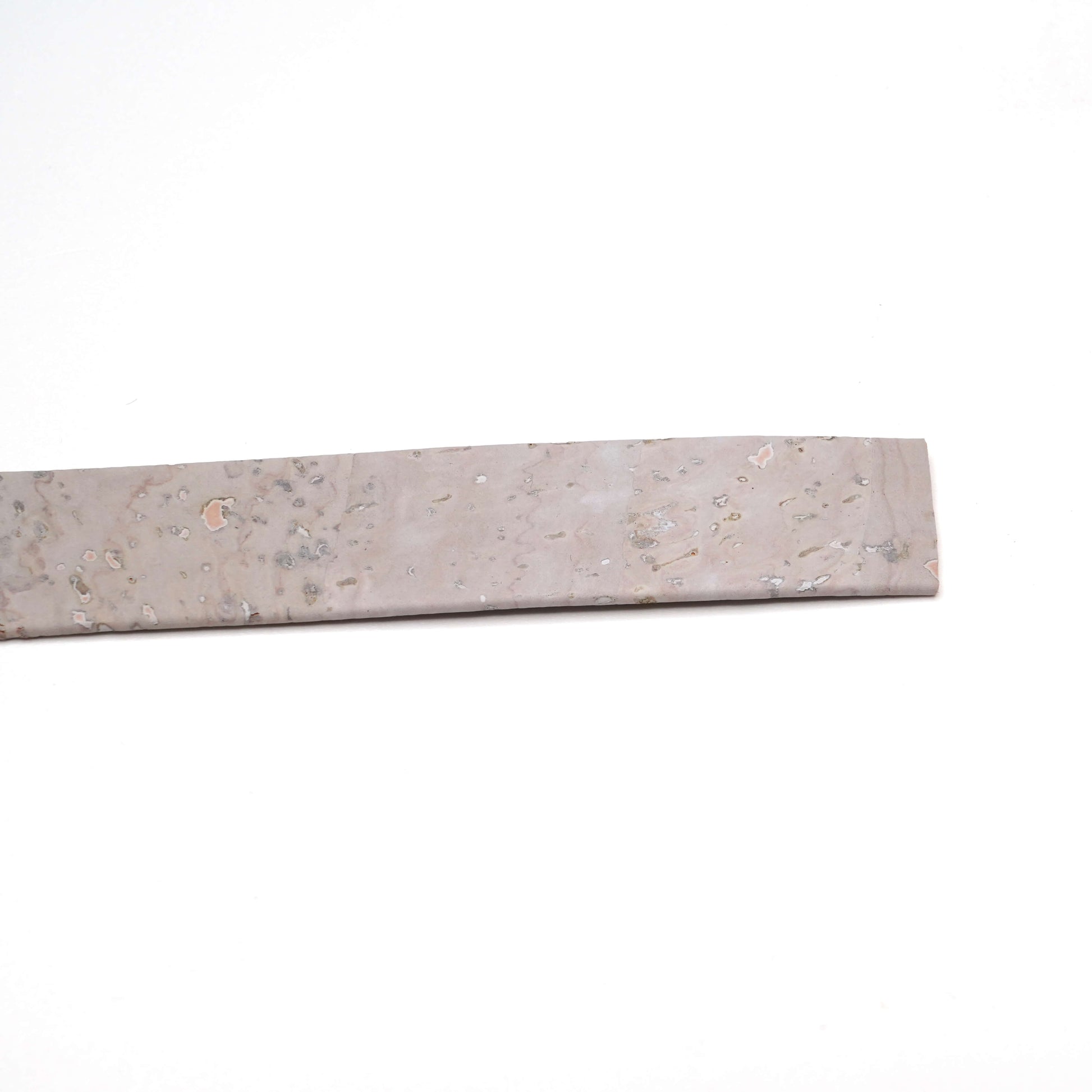 Rectangular stone slab with speckled pattern on a white background