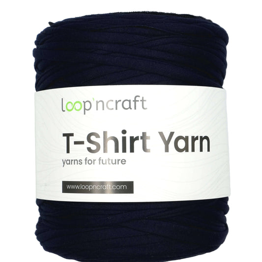 A large skein of Loop'n Craft T-Shirt Yarn in a dark navy blue color, wrapped with a white paper label showing the brand name and product details.