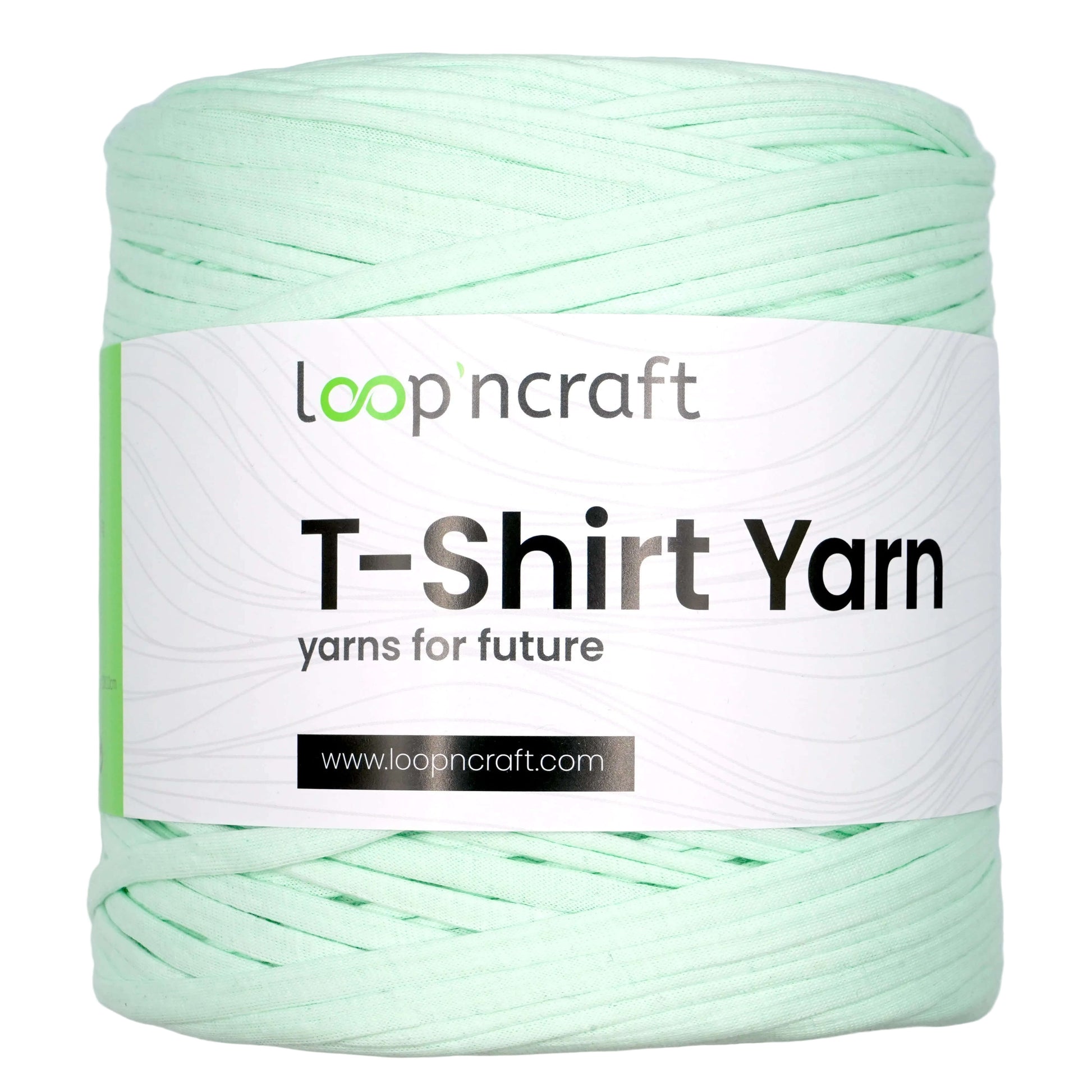 A spool of Loopncraft T-Shirt Yarn in a pale mint green color, featuring a white paper label with the brand name 'loopncraft' and product details.