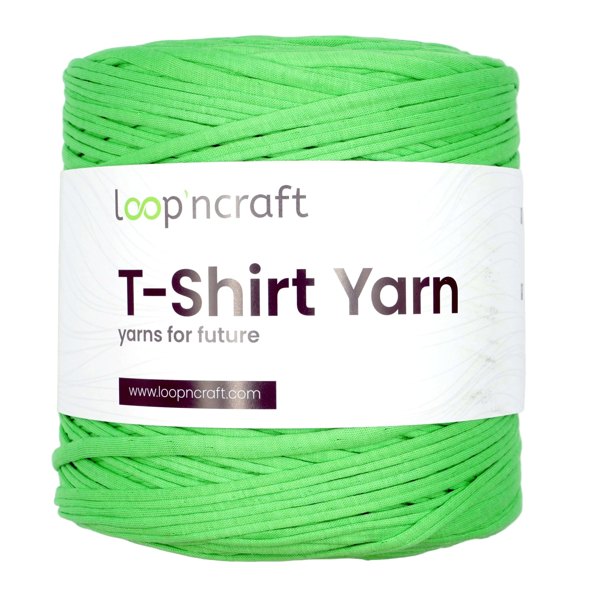 A bright green spool of Loop 'ncraft T-Shirt Yarn wrapped in a white paper label, shown on a solid white background.