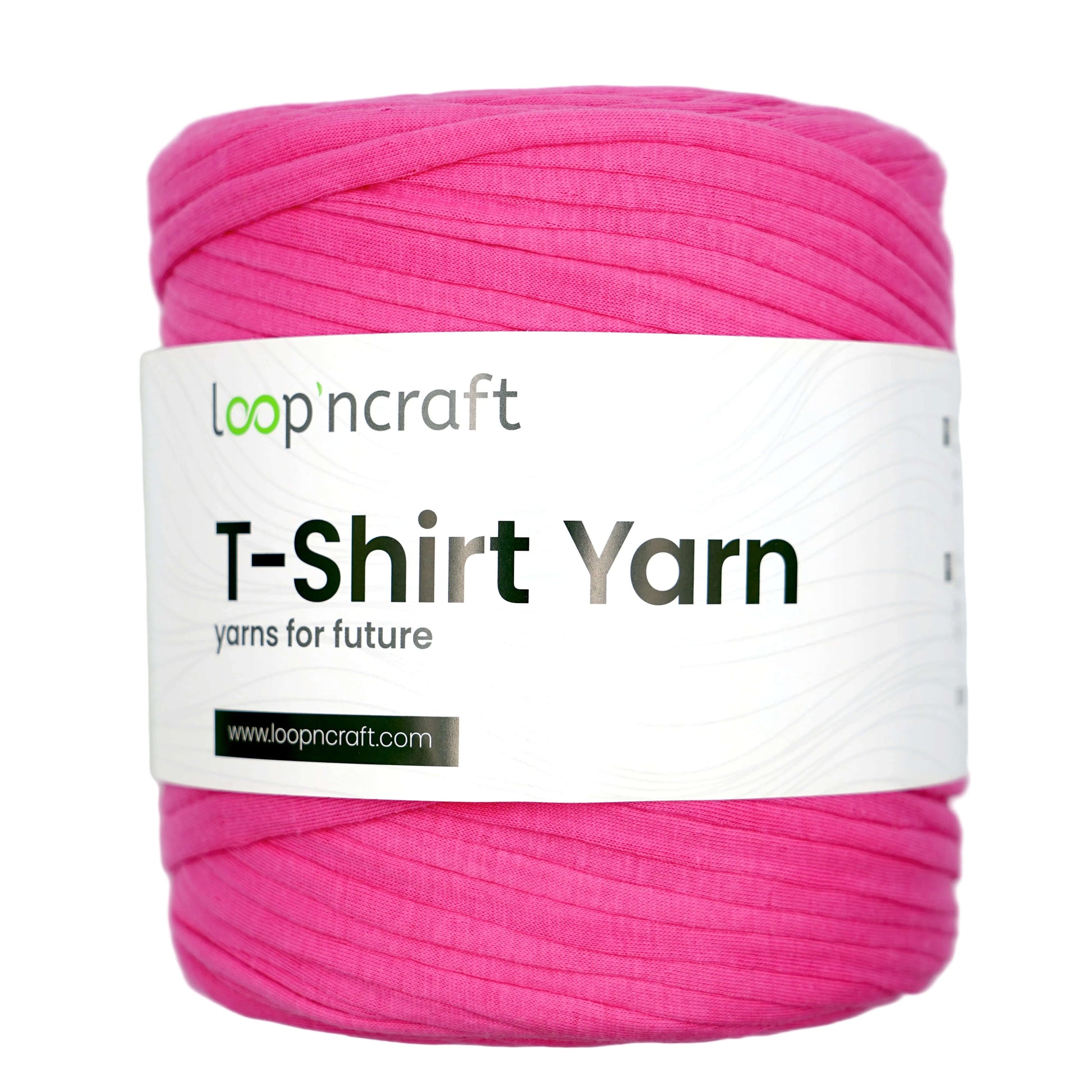 A skein of bright pink T-shirt yarn wrapped with a white paper label that reads 'loopncraft T-Shirt Yarn' on a light gray background.