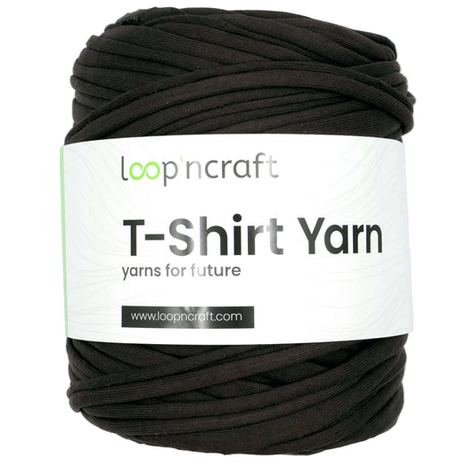 A skein of black looped T-shirt yarn with a white paper label reading 'loop'n craft T-Shirt Yarn' on a light gray background.